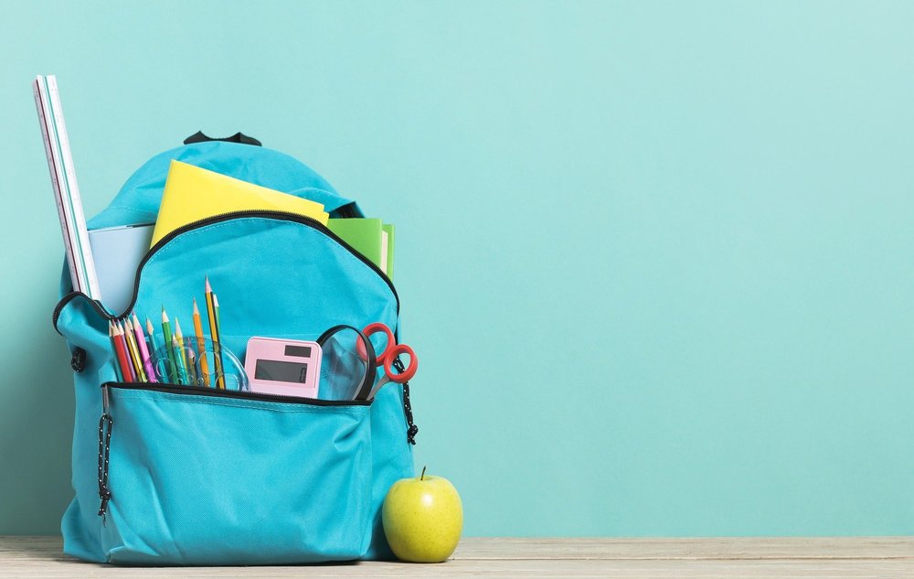 blue backpack with school supplies
